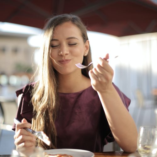 Girl happily eating mindfully