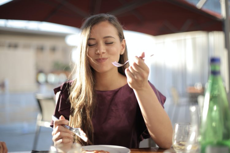 Girl happily eating mindfully